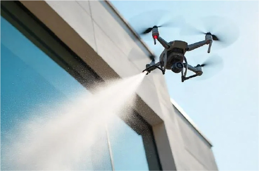 Drone spraying a building facade